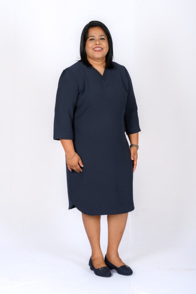 A woman in a dark dress.